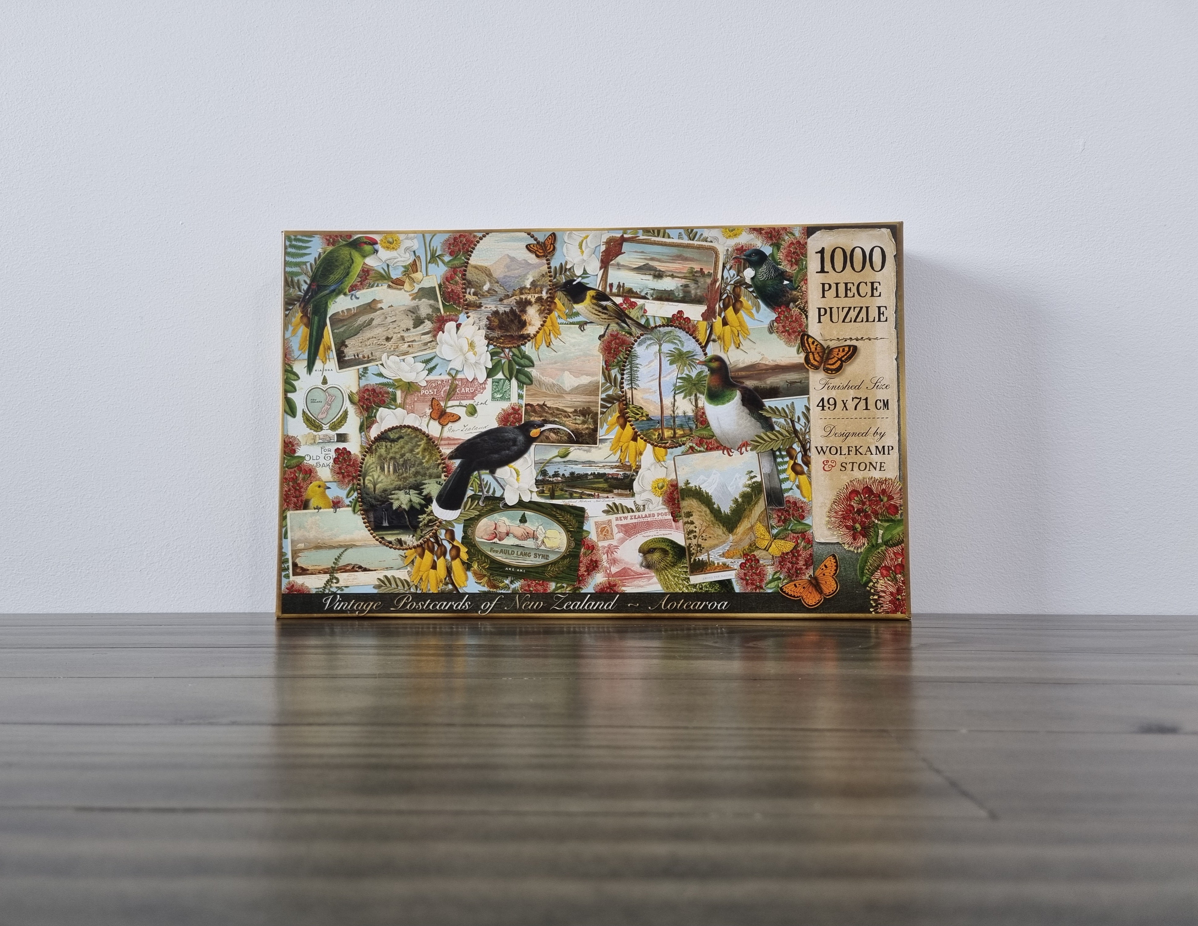 A 1000 piece puzzle with a decoupage of vintage New Zealand postcards, native birds, flowers and butterflies. Designed in New Zealand by Wolfkamp and Stone.