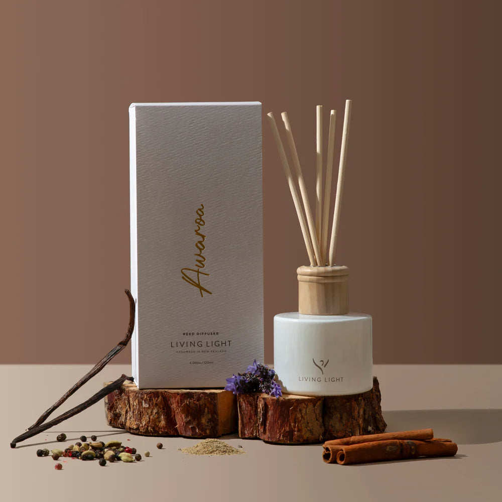Awaroa oriental scented reed diffuser presented in a white glass bottle with natural wooden cap, which comes in an earthy natural coloured box. Made in New Zealand by Living Light.