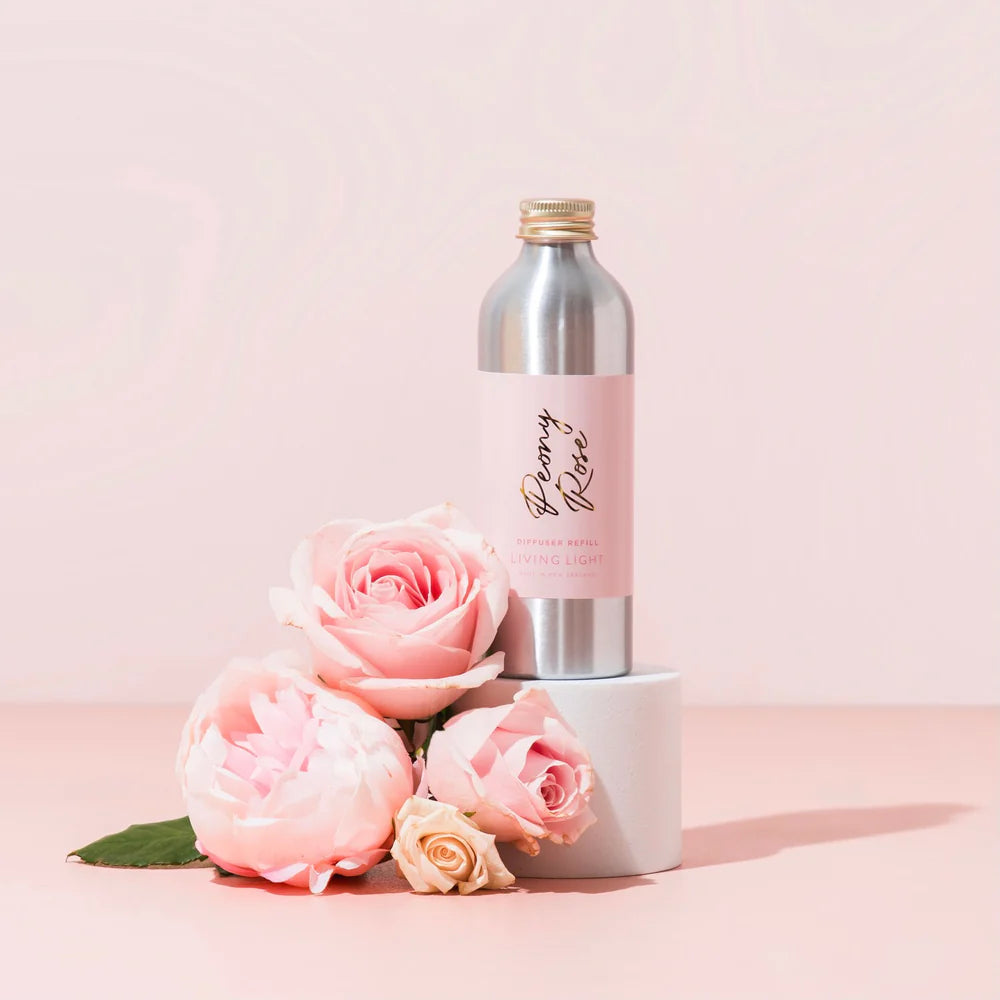 A bottle of peony rose scented diffuser refill, made by living light in New Zealand.