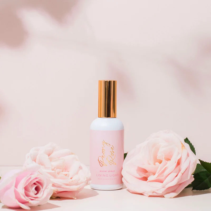 A peony rose scented room spray fragrance, presented in a white glass bottle, with gold cap. Made in New Zealand by Living light.
