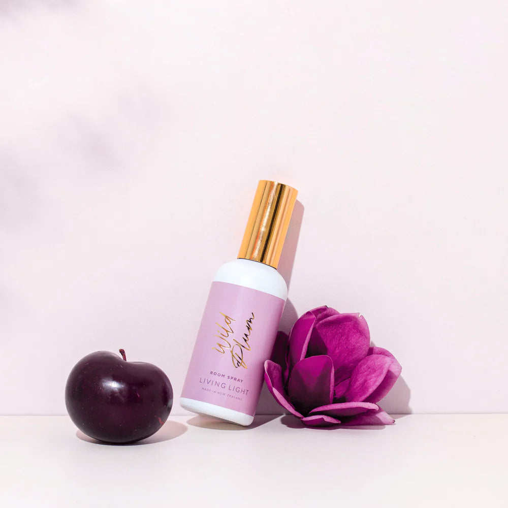 A wild plum scented room spray fragrance, presented in a white glass bottle, with gold cap. Made in New Zealand by Living light.