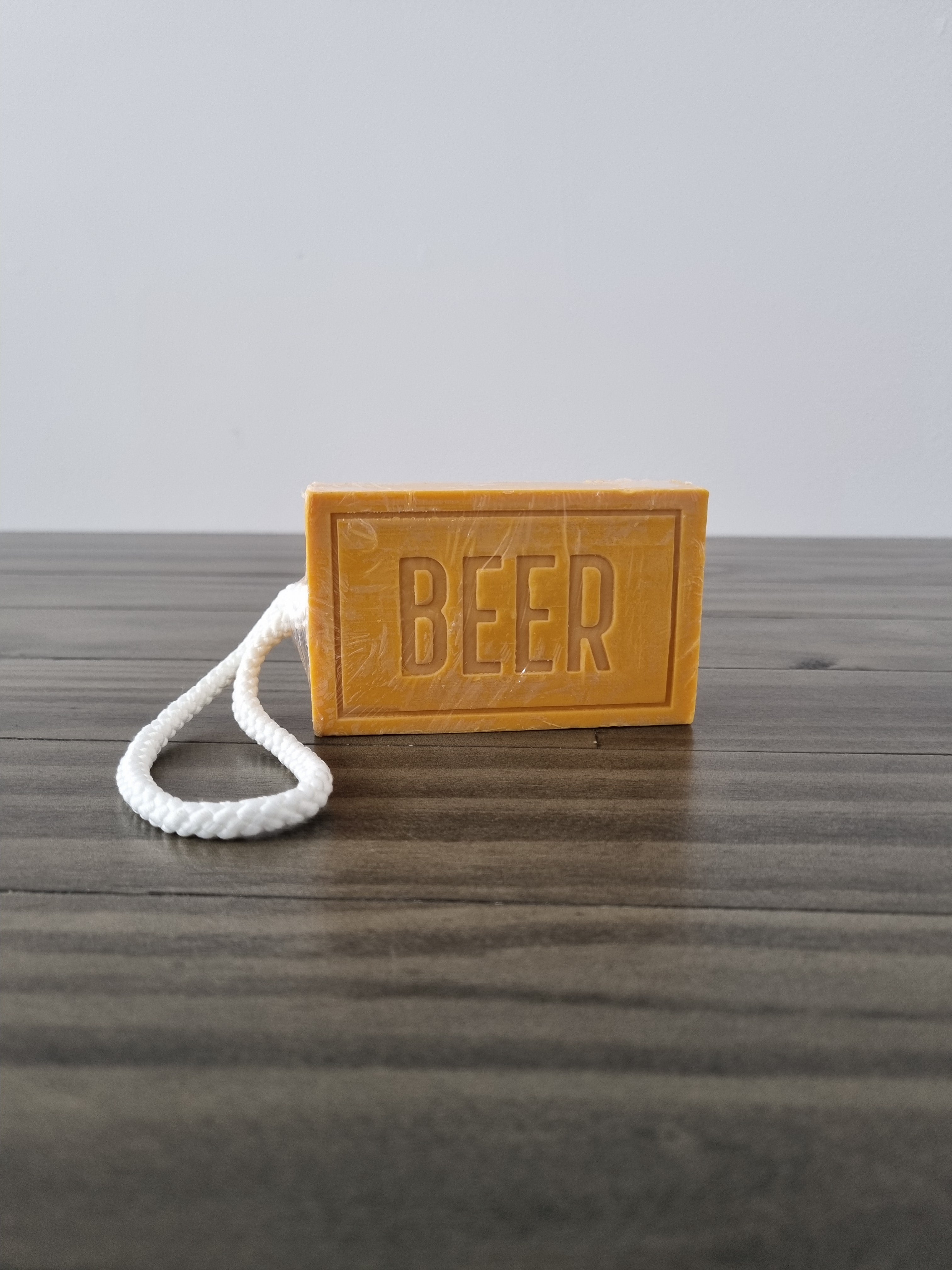 Novelty beer scented soap on a rope, imprinted with the word beer. Made by mens republic.