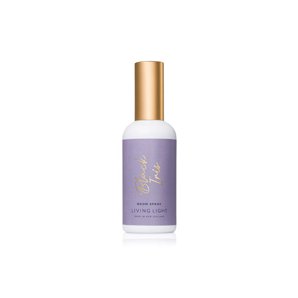 A black iris scented room spray fragrance, presented in a white glass bottle, with gold cap. Made in New Zealand by Living light.