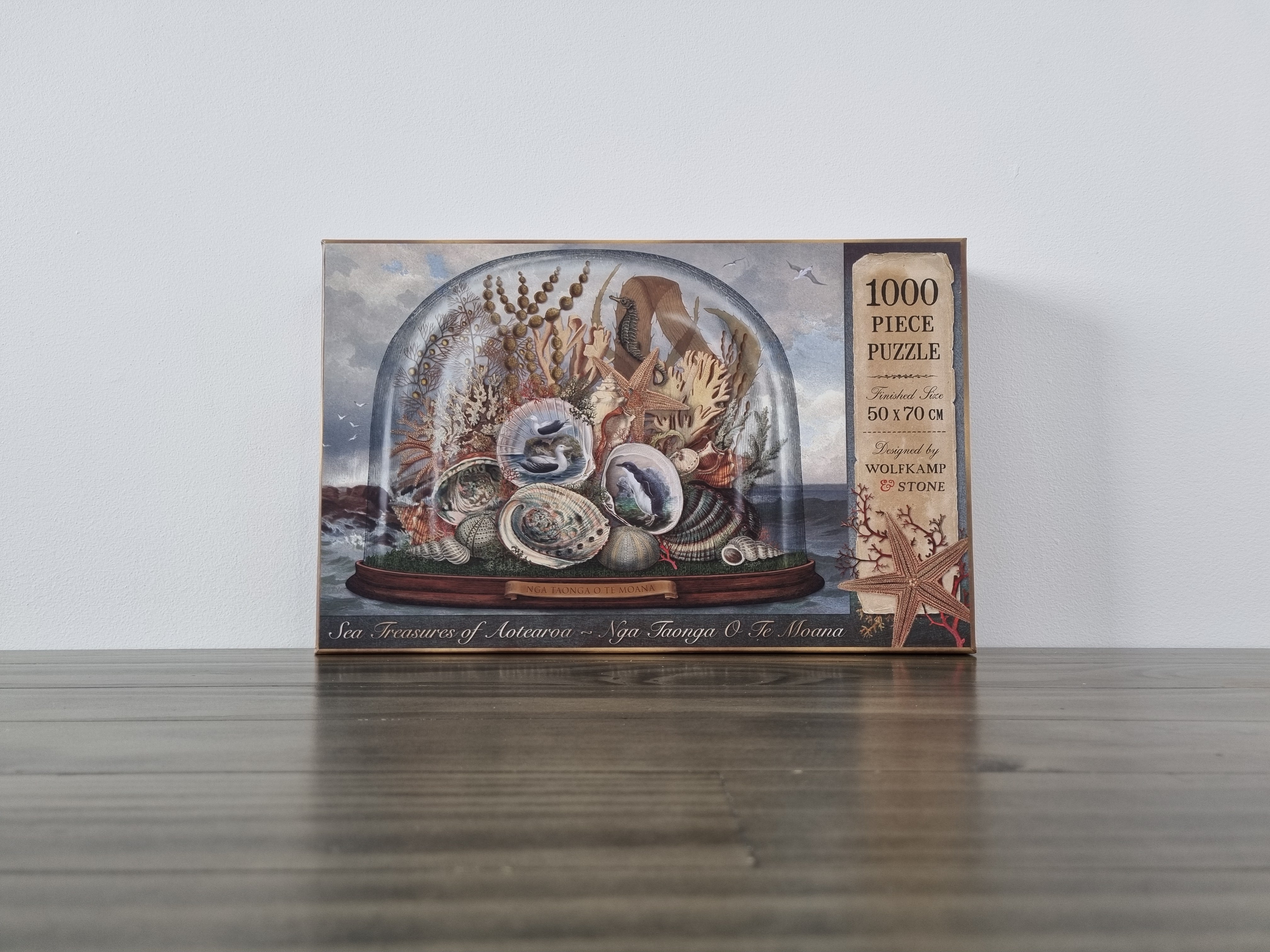 A kiwiana 1000 piece puzzle depicting sea treasures of aotearoa designed in new zealand by wolfkamp and stone. 