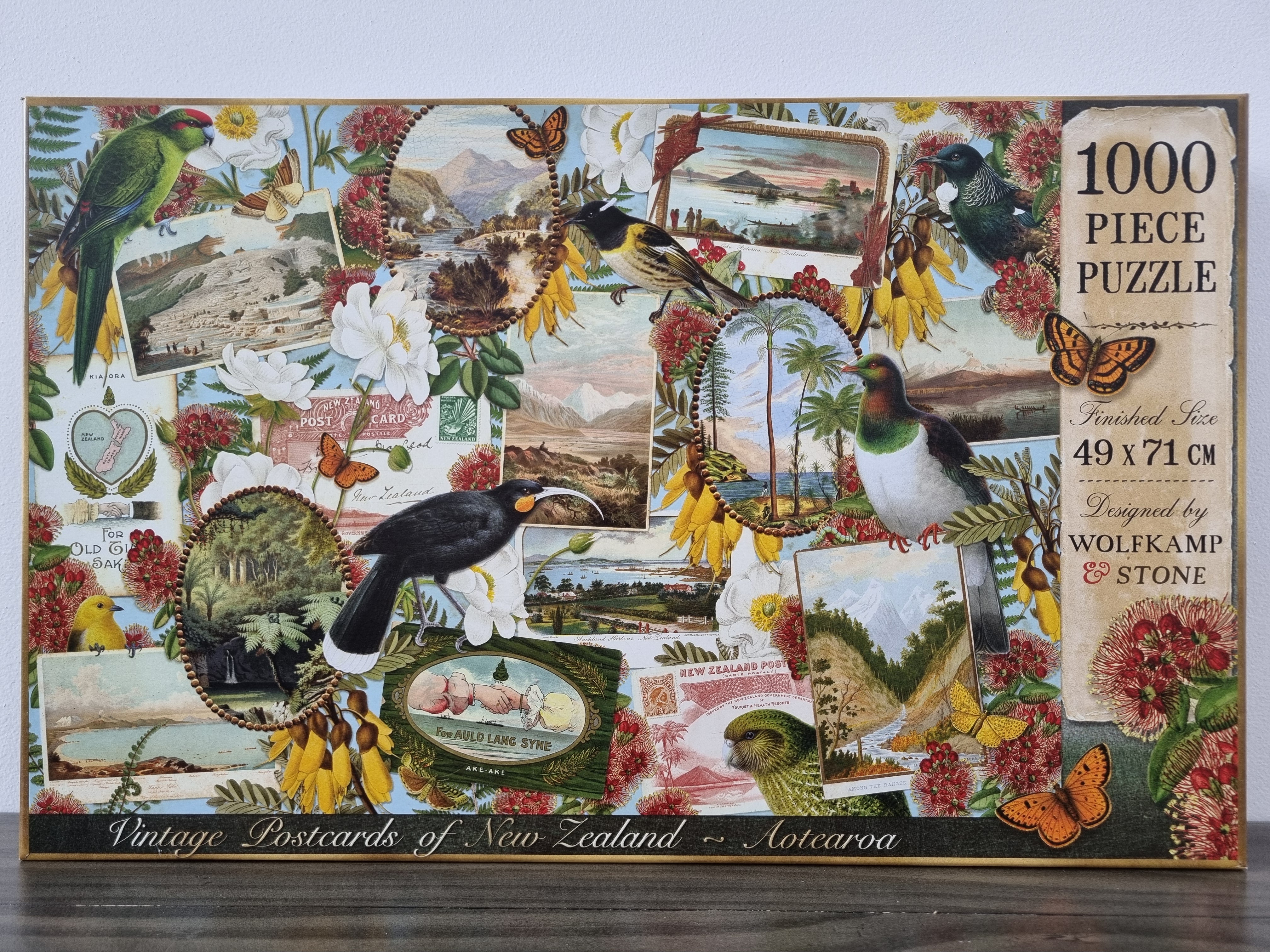 A 1000 piece puzzle with a decoupage of vintage New Zealand postcards, native birds, flowers and butterflies. Designed in New Zealand by Wolfkamp and Stone.